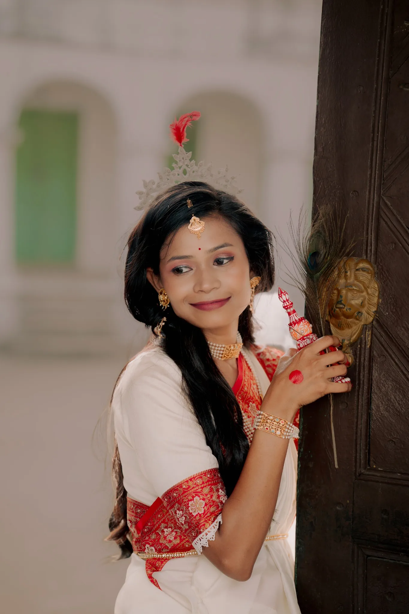 Bride portrait beside a wooden doorway
