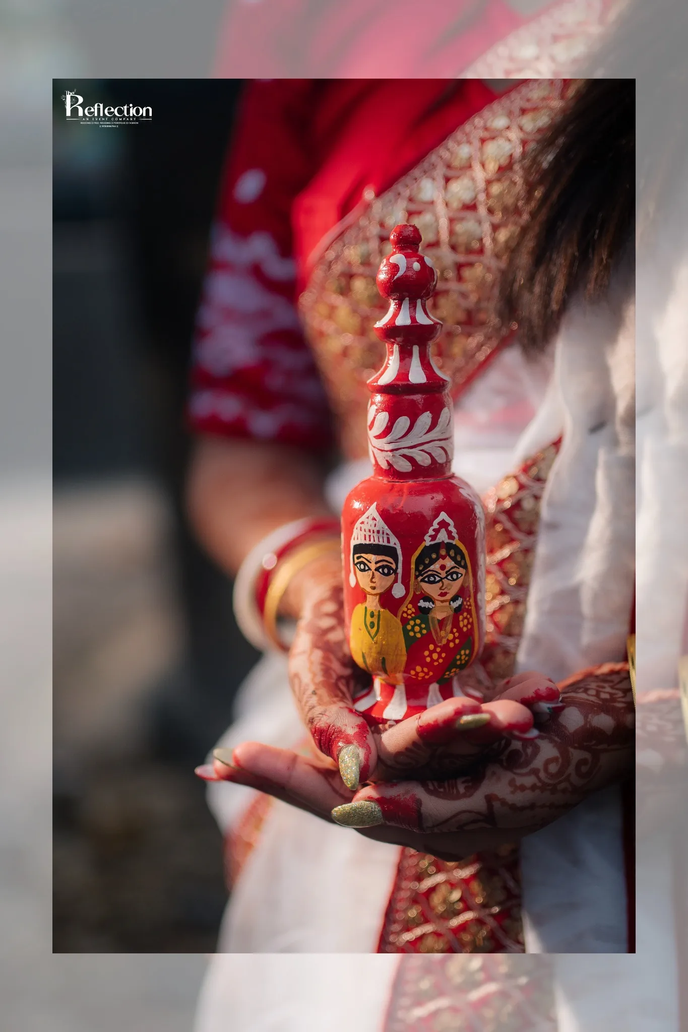 Close-up wedding detail with traditional Bengali bridal accessory