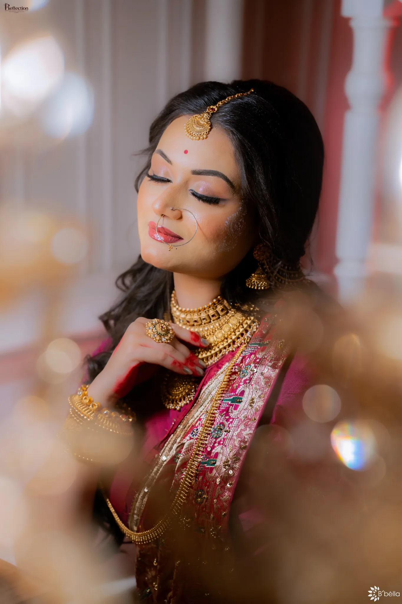 Close-up bridal portrait with traditional jewellery and warm bokeh