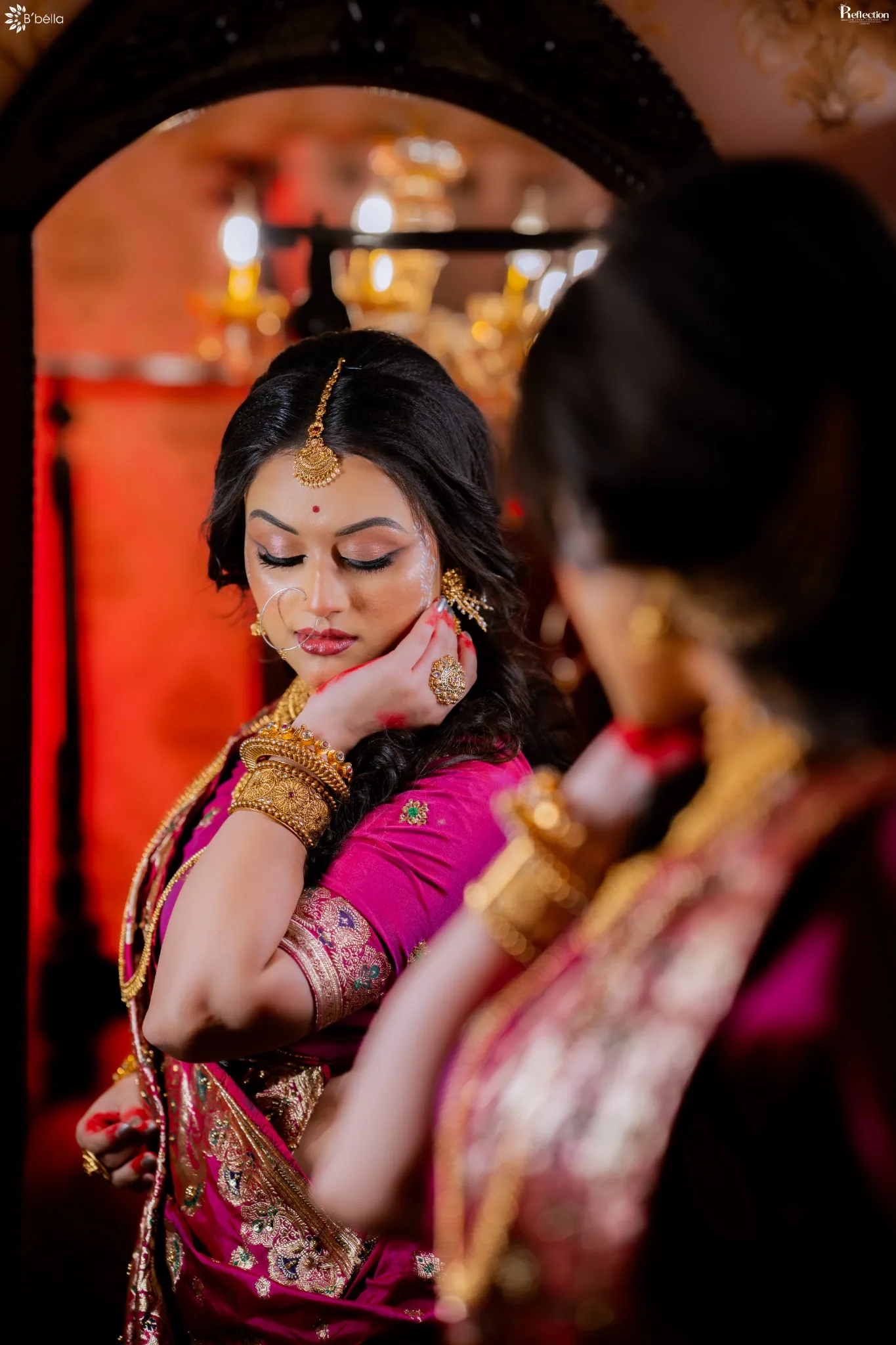 Bride photographed through a mirror with warm cinematic light
